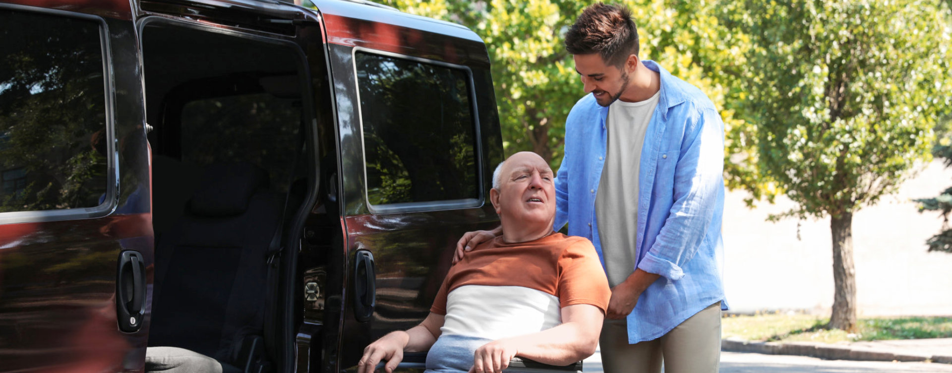 caregiver helping senior with wheelchair