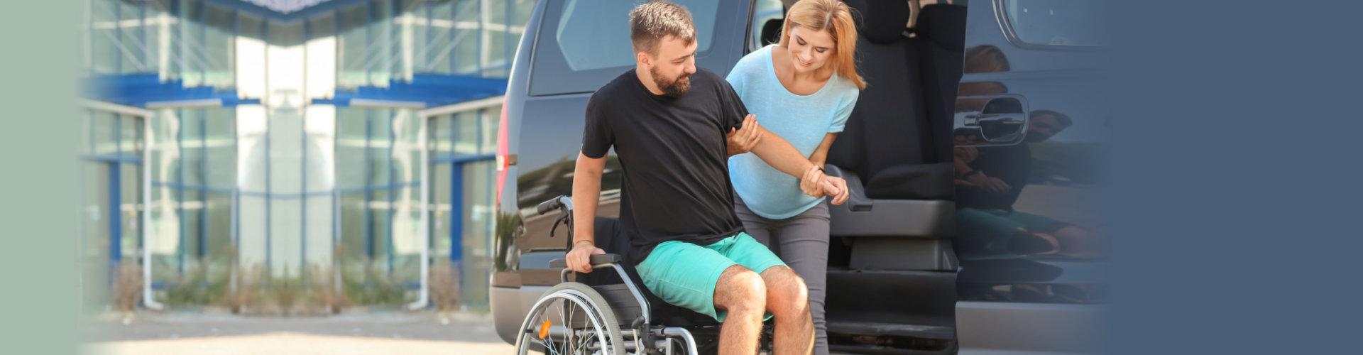 Woman helping handicapped man to sit in car